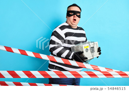 emotional puzzled prisoner with safe posing to the camera 54846515
