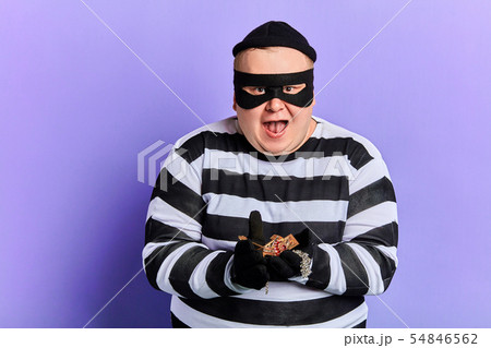 fat happy excited burglar holding jewel in palms and looking at the camera 54846562