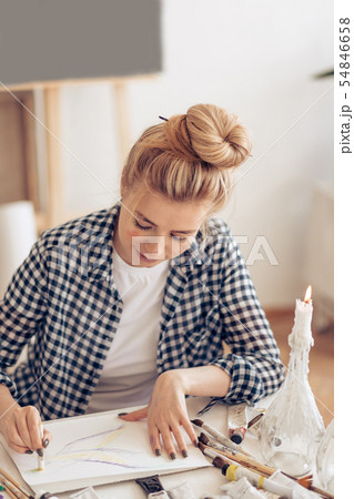 blond girl practicing pastel techniques blond girl practicing pastel techniques 54846658