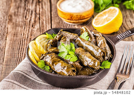 Dolma, stuffed grape leaves with rice and meat. Dolma, stuffed grape leaves with rice and meat. 54848102