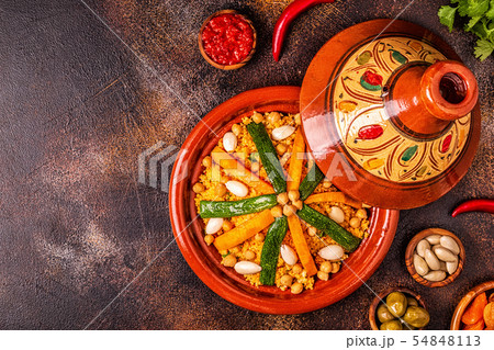 Vegetable tagine with almond and chickpea couscous Vegetable tagine with almond and chickpea couscous 54848113