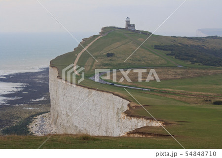 White chalk cliffs and Beachy Head Lighthouse. Eastbourne, East Sussex, England. Highest chalk sea White chalk cliffs and Beachy Head Lighthouse. Eastbourne, East Sussex, England. Highest chalk sea 54848710