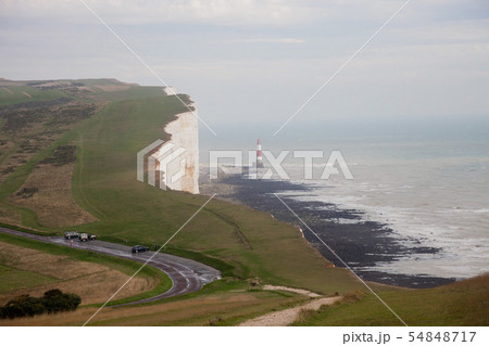 White chalk cliffs and Beachy Head Lighthouse. Eastbourne, East Sussex, England. Highest chalk sea White chalk cliffs and Beachy Head Lighthouse. Eastbourne, East Sussex, England. Highest chalk sea 54848717
