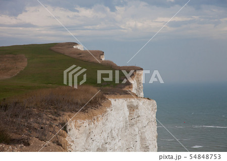 White chalk cliffs and Beachy Head Lighthouse. Eastbourne, East Sussex, England. Highest chalk sea 54848753