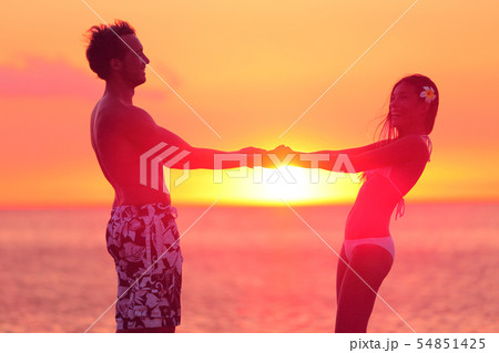 Romantic lovers couple dancing in bikini at beach Romantic lovers couple dancing in bikini at beach 54851425