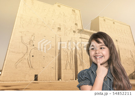 Smiling little girl is standing in front of Edfu Smiling little girl is standing in front of Edfu 54852211