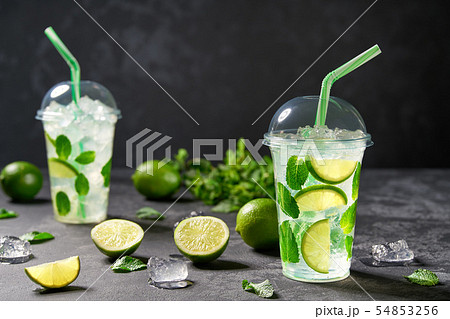 Summer  cocktail -mojito  in a plastic clear cup 54853256