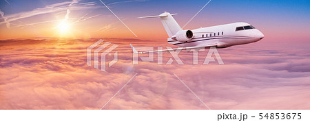 Small private jetplane flying above beautiful clouds. 54853675