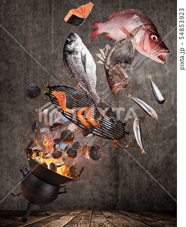 Kettle grill with fire flames, cast iron grate and tasty sea fishes flying in the air. Kettle grill with fire flames, cast iron grate and tasty sea fishes flying in the air. 54853923