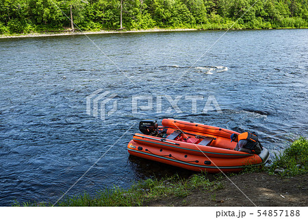 inflatable motor boat. fishing boat on a mountain river. Anyui River. Khabarovsk territory, far East inflatable motor boat. fishing boat on a mountain river. Anyui River. Khabarovsk territory, far East 54857188