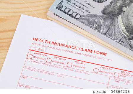 Health insurance claim form on wooden desk 54864238
