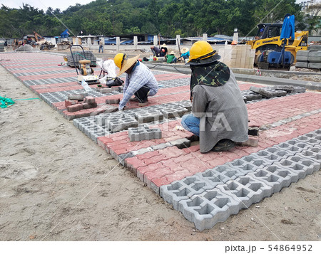 Concrete pavers preparation and installation work Concrete pavers preparation and installation work 54864952