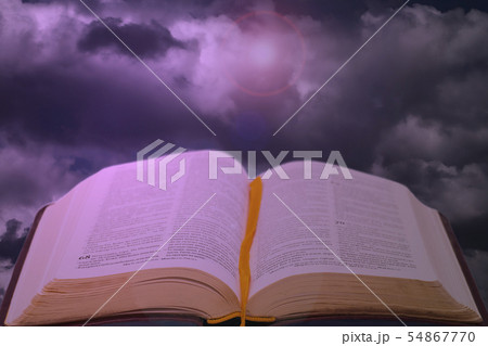 Open bible book on dramatic shiny sky Open bible book on dramatic shiny sky 54867770