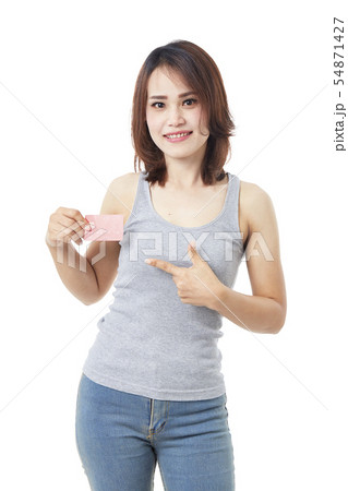 young smiling woman holding credit card young smiling woman holding credit card 54871427