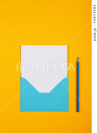 Open blue paper envelope over yellow 54873485