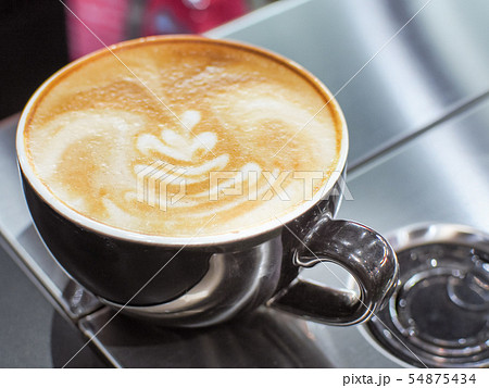 Cup of latte or cappuccino with latte art. Cup of latte or cappuccino with latte art. 54875434