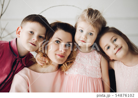 Portrait of cute family looking at camera and Portrait of cute family looking at camera and 54876102