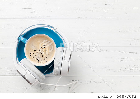 Headphones and coffee cup 54877082