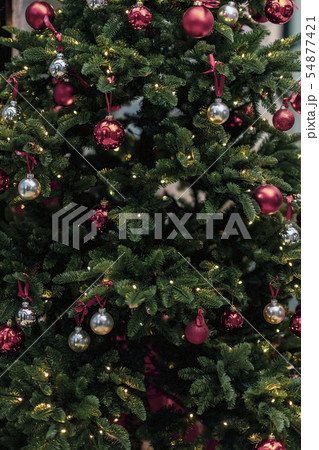 Christmas fir tree in decorations with balls, closeup background 54877421