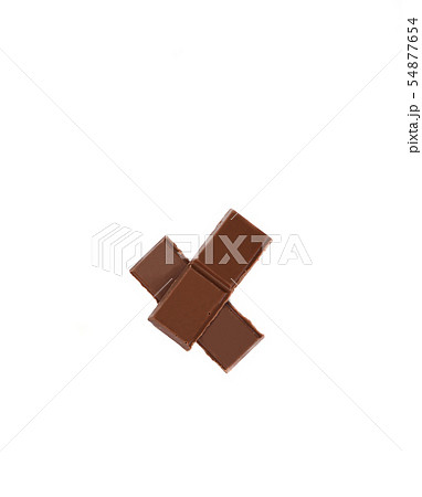 Milk organic chocolate pieces isolated over white background. 54877654