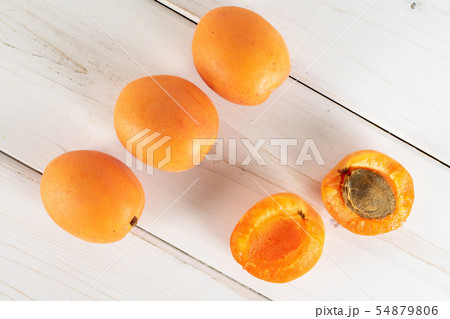 Fresh orange apricot on grey wood 54879806