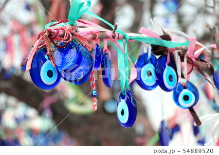 Evil eye charms hang from a tree in Cappadocia, Evil eye charms hang from a tree in Cappadocia, 54889520