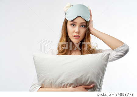 woman in pajamas and sleep mask  54893773