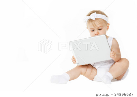 little girl all in white with a tablet little girl all in white with a tablet 54896637