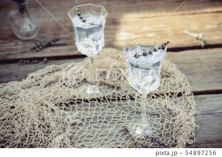 Fresh lavender lemonade with flowers and ice cubes 54897256