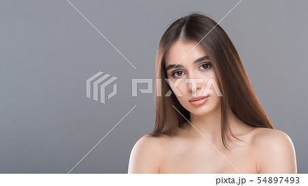 Young nude gorgeous woman portrait, grey panorama background Young nude gorgeous woman portrait, grey panorama background 54897493