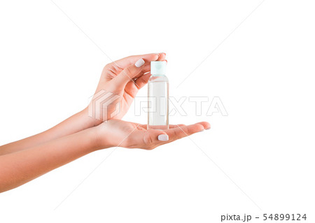 Female hand holding cream bottle of lotion Female hand holding cream bottle of lotion 54899124