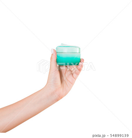 Female hand holding cream bottle of lotion 54899139