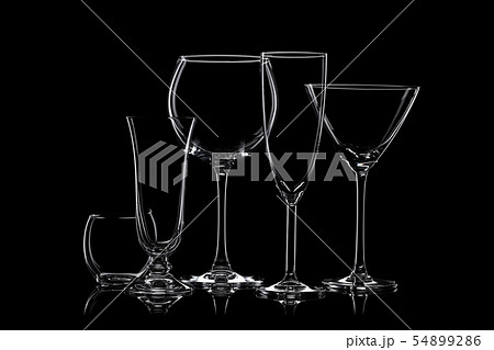 Glassware silhouettes on black. 54899286