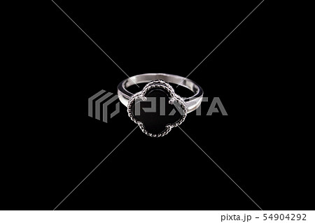Ring with black stone in the shape of a flower Ring with black stone in the shape of a flower 54904292