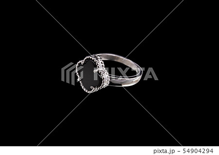 Silver ring with a stone inside on a black Silver ring with a stone inside on a black 54904294