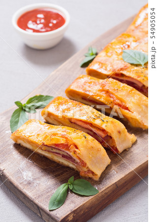 Pizza roll stromboli with cheese salami olives and 54905054