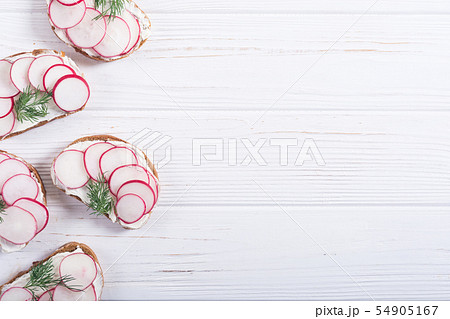 Healthy vegetable toasts sandwith with radish and 54905167
