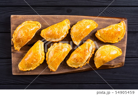 Latin American baked beef empanadas with sauce Latin American baked beef empanadas with sauce 54905459