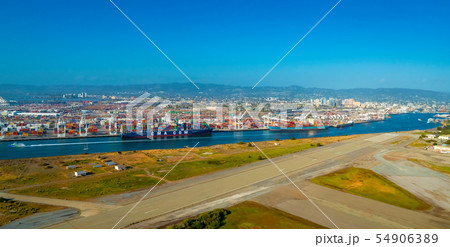 Oakland Harbor port terminal with shipping containers 54906389