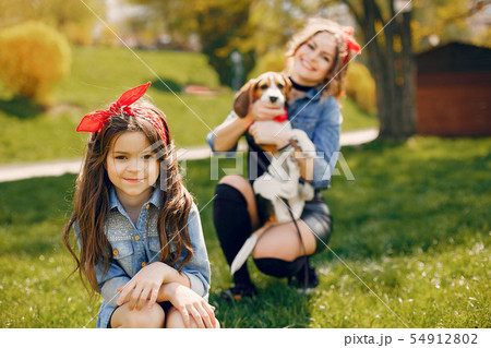 Cute and stylish family in a spring park 54912802