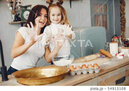 Family cook the dough for cookies Family cook the dough for cookies 54913108