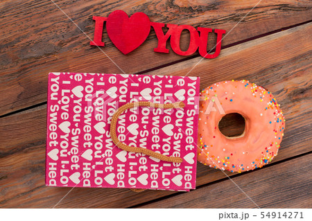 Frosted donut and I love you inscription. 54914271