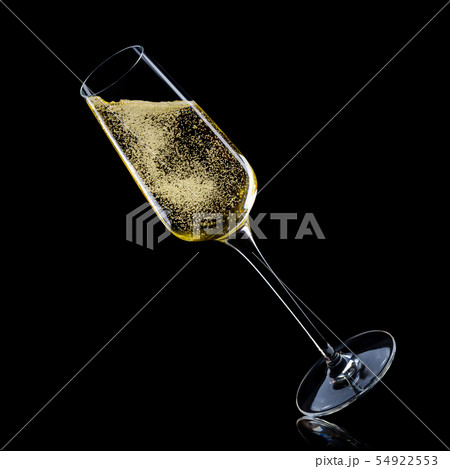 Glass for champagne with splashes isolated on black background. Glass for champagne with splashes isolated on black background. 54922553