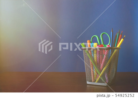 Schoolchild and student studies accessories. Back to school concept. Pencils and felt pens on blue 54925252