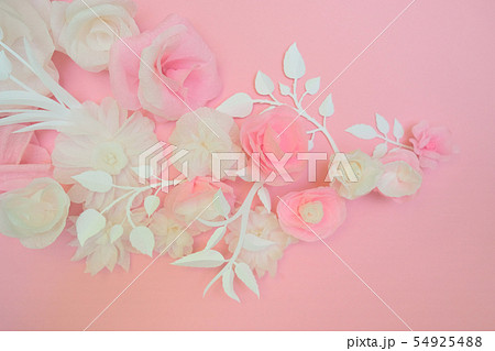 White paper flowers on pink background. White paper flowers on pink background. 54925488