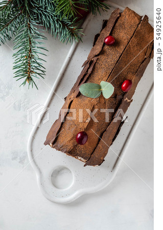 Bush de Noel Christmas Log Cake and New Year background. Copy space. Bush de Noel Christmas Log Cake and New Year background. Copy space. 54925640