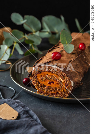 Buche de Noel. Traditional Christmas dessert, Christmas yule log cake with chocolate cream Buche de Noel. Traditional Christmas dessert, Christmas yule log cake with chocolate cream 54925660