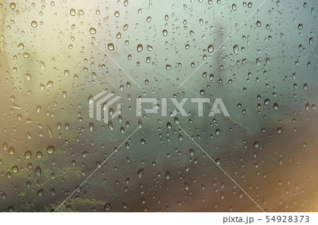 Rain drops on window, blur background Rain drops on window, blur background 54928373