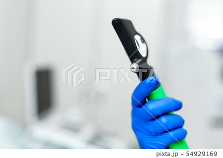 doctor hand in blue rubber glove hold professional doctor hand in blue rubber glove hold professional 54929169