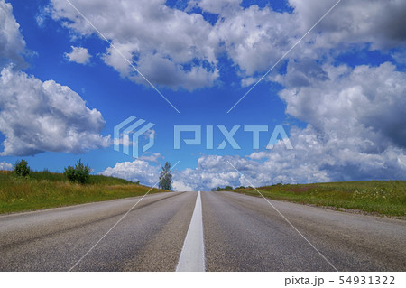 Low angle view of a tarred road receding Low angle view of a tarred road receding 54931322
